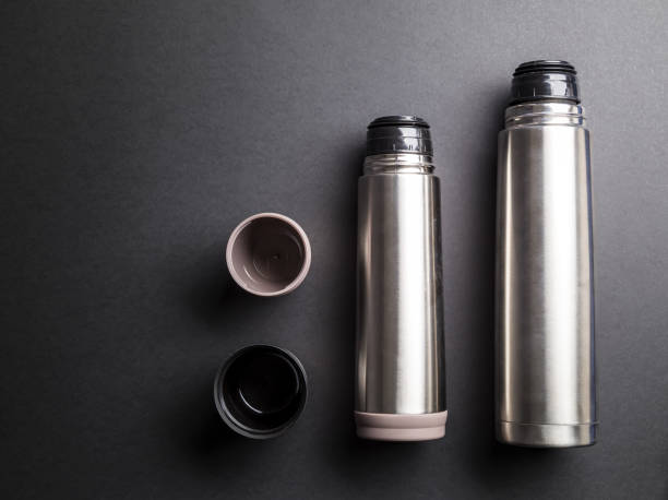 istock Thermoses organized over black background 1135477593