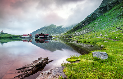 Sunrise at glacial Balea Lac in a foggy morning, the Carpathian Mountains Romania