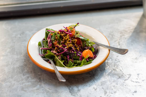 istock Green salad with mung bean, tangerine and red cabbage 1135478993