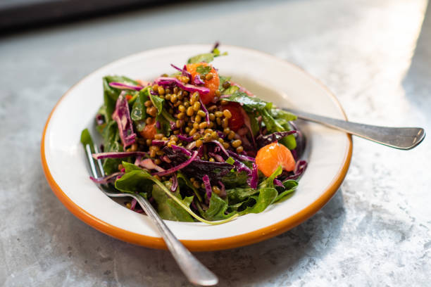 istock Green salad with mung bean, tangerine and red cabbage 1135479038