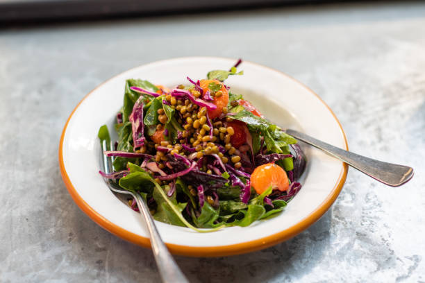 istock Green salad with mung bean, tangerine and red cabbage 1135479136