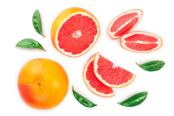 istock Grapefruit and slices with leaves isolated on white background. Top view. Flat lay pattern 1135479238