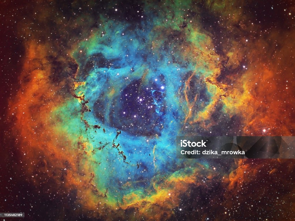 The Rosette Nebula (NGC 2237, Caldwell 49) in the constellation of Monoceros, HST image The Rosette Nebula (NGC 2237, Caldwell 49) is the large hydrogen, sulfur and oxygen gas cloud in the constellation of Monoceros. The open star cluster NGC 2244 (Caldwell 50) consists of stars being formed from the nebula. The nebula is 5,200 light years away from Earth. Amateur image, total exposure time: 15h45m, HST palette image. Outer Space Stock Photo