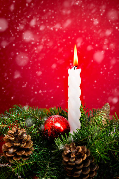 istock Christmas candle and fir branches 1135482249