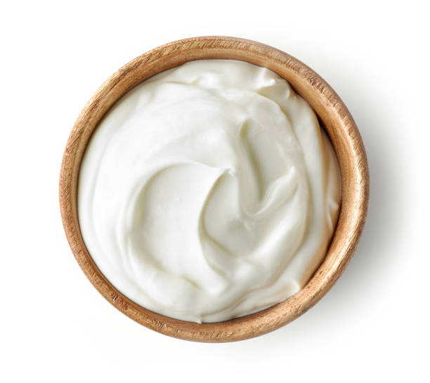 istock sour cream or yogurt in wooden bowl 1135483720