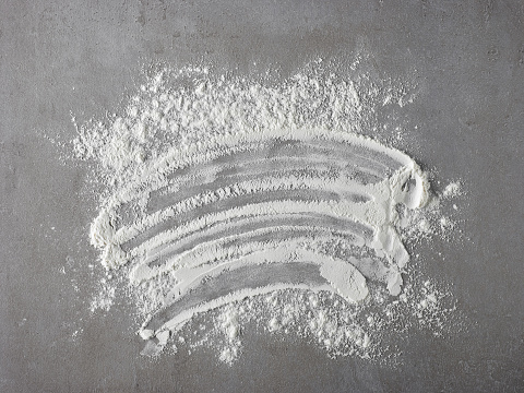 Wheat flour on black background
