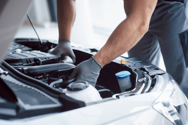 istock Auto mechanic working in garage. Repair service 1135483739