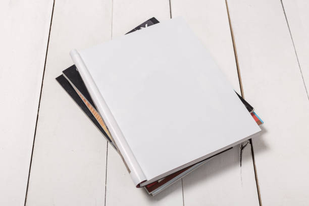 istock Mock-up magazine or catalog on wooden table. Blank page or notepad on wood background. Blank page or notepad for mockups or simulations 1135485207