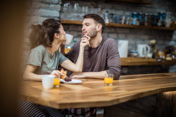 istock Loving couple talking during morning coffee at home. 1135486159
