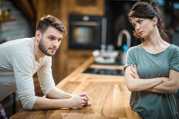 istock Young couple ignoring each other at home. 1135487598