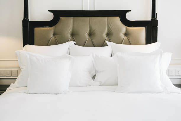 istock Beautiful luxury comfortable white pillow on bed decoration in bedroom 1135487813