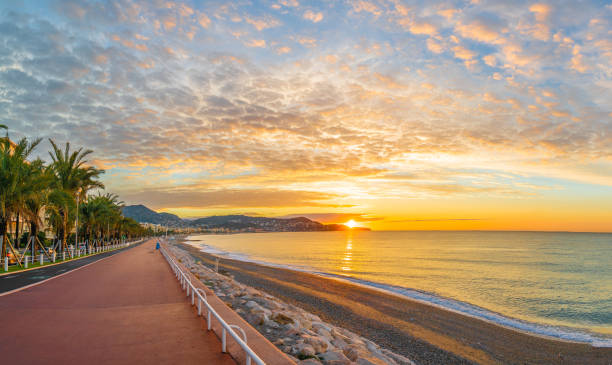 Landscape with colorful sunrise in Nice Landscape with colorful sunrise panorama over the bay of Angels, Nice, French Riviera coast french riviera photos stock pictures, royalty-free photos & images