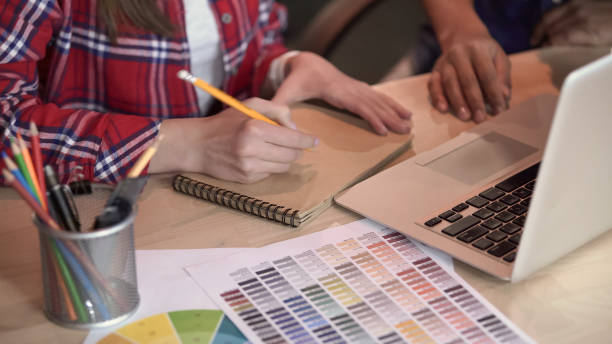 istock Designer and decorator working on project, drawing sketches, proposing ideas 1135490790
