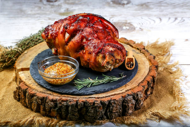 german food concept. roasted pork knuckle with sauerkraut. cooking bavarian pork knuckle - shank sauerkraut german cuisine pork imagens e fotografias de stock