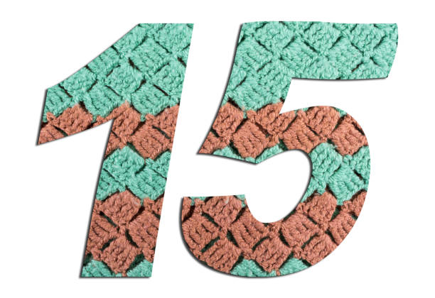 istock Number 15  with hand knitted texture on white background 1135492272