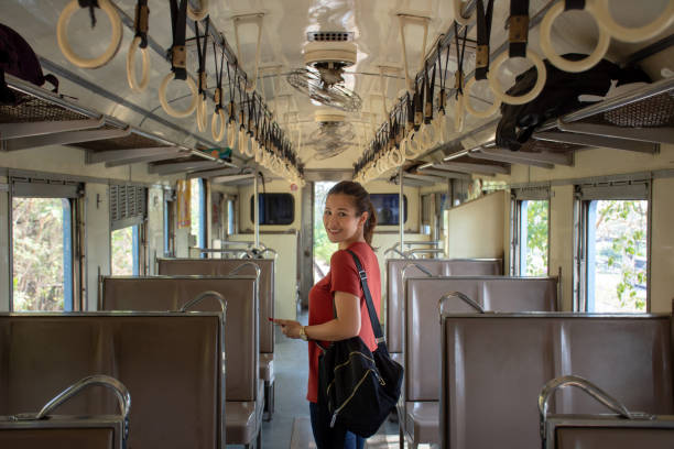 istock Asian woman backpacker inside the public train on vacation 1135492937