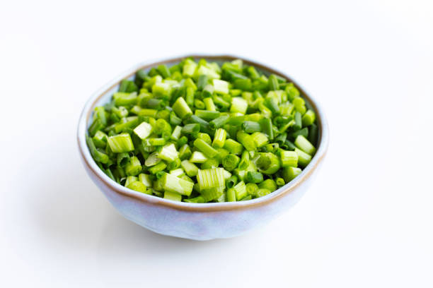 istock Green onions isolated on white 1135498483