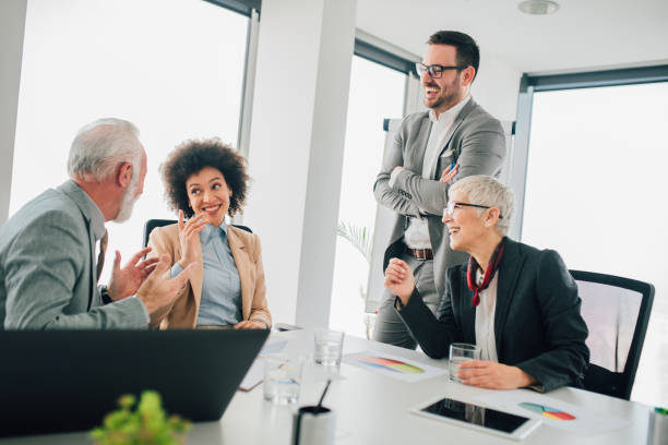 istock Happy business people at office 1135498578