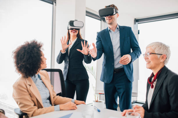 istock Coworkers wearing virtual reality at office 1135499143