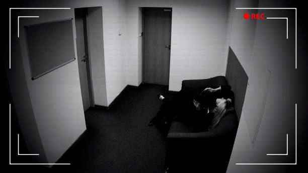 istock Two co-workers kissing in office, romantic relationship at work, CCTV camera 1135499843