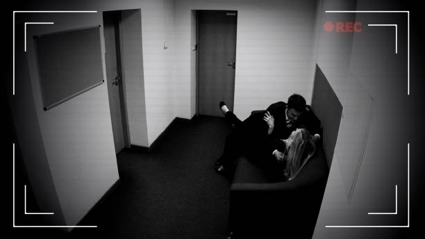 istock Colleagues couple hugging on office sofa, romantic relationship, CCTV camera 1135499860