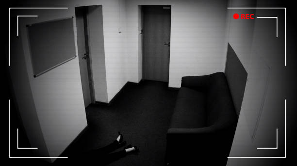 istock Unconscious female lying on floor in empty corridor, surveillance camera record 1135499861