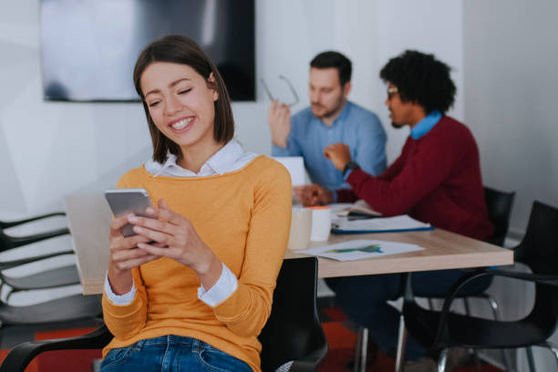istock Young businesswoman using smart phone in the office 1135501369