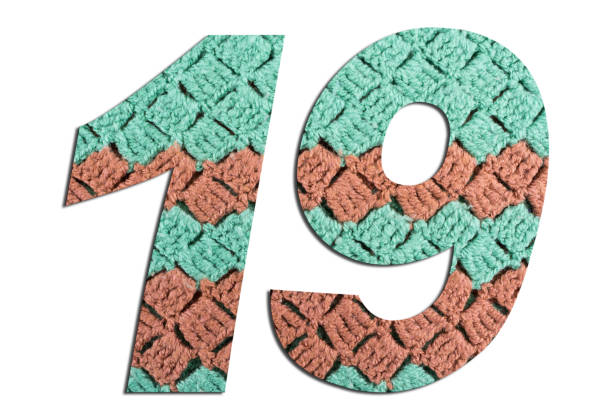 istock Number 19  with hand knitted texture on white background 1135501874