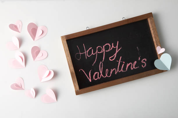 istock Pink Paper Heart with Blackboard Valentine's day concept 1135502945