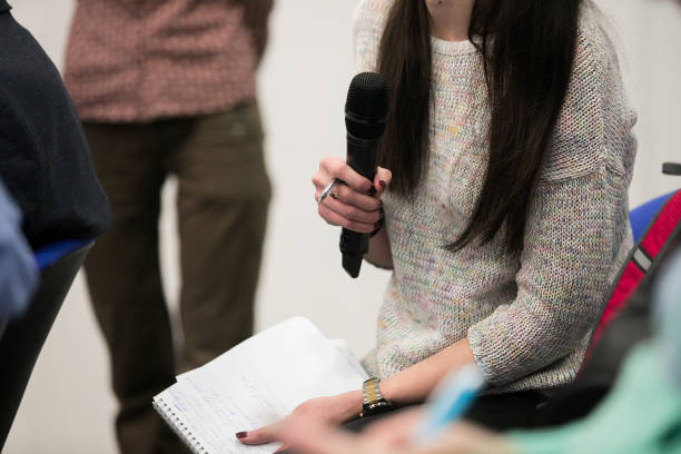 istock Microphone for interviewing and asking questions in news report, with blurred background of journalist 1135504728
