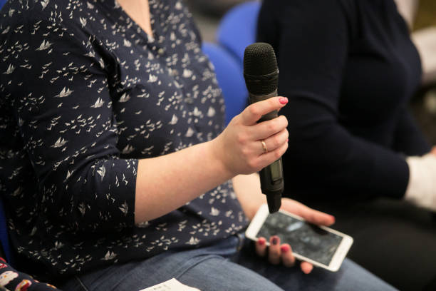 istock Microphone for interviewing and asking questions in news report, with blurred background of journalist 1135504830