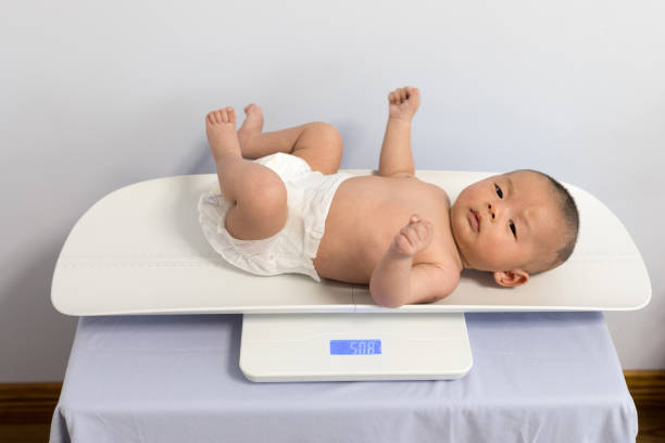 istock Chinese newborn measuring body weight 1135506148
