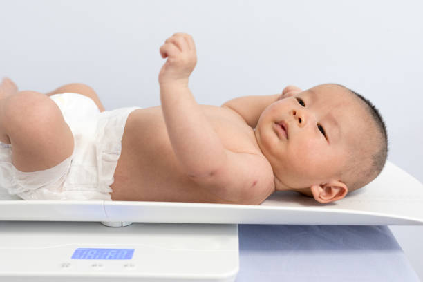istock Chinese newborn measuring body weight 1135506183