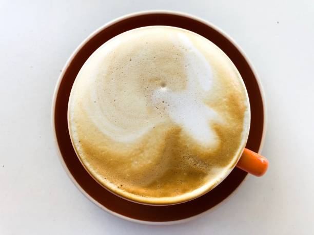 istock Close up of a cappuccino cup on a table 1135506201