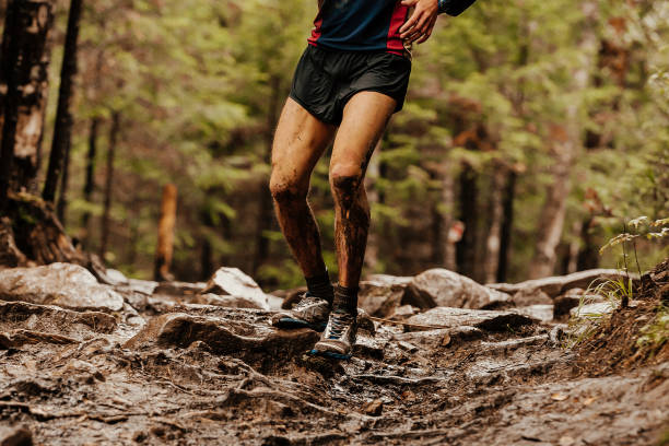 istock male runner running on dirty stones 1135506370
