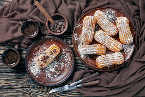 istock Eclairs with powdered sugar and chocolate drops 1135509077