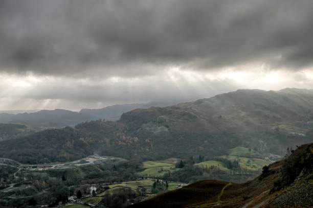 istock Crepuscular rays and the Great Langdale valley. 1135510382