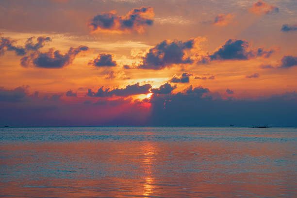 istock beautiful stunning view of sunset on the beach 1135510614
