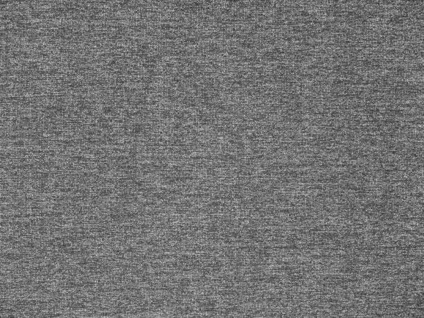 Dark heather gray polyester activewear knitted fabric Dark heather gray polyester activewear knitted fabric texture swatch polyester photos stock pictures, royalty-free photos & images