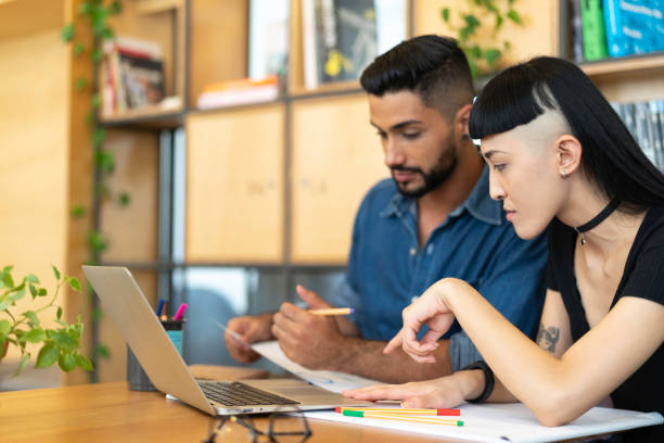 istock Business partners working at modern startup office 1135512235