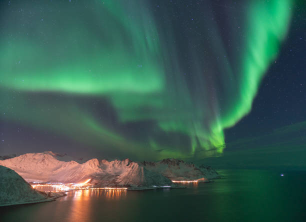 istock Aurora Borealis by norwegian fjord 1135513066