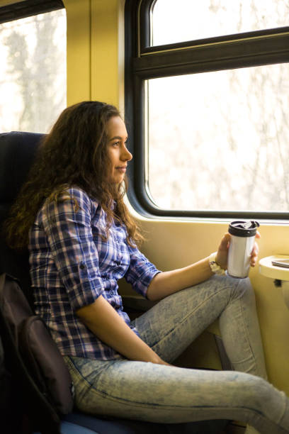 istock Young woman traveling by train 1135515468