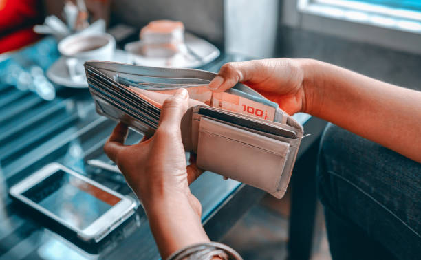 istock Asia women gets money from the wallet. 1135516499