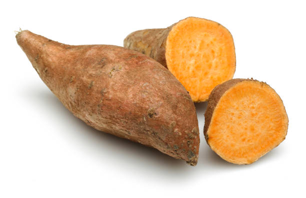 istock Raw sweet potato with slice isolated on white 1135517341