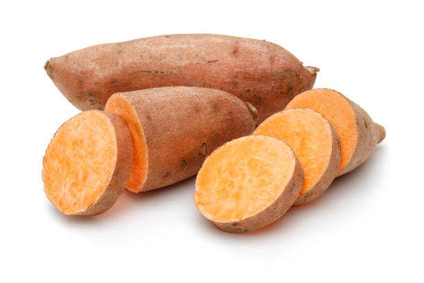 istock Raw sweet potato with slice isolated on white 1135517589