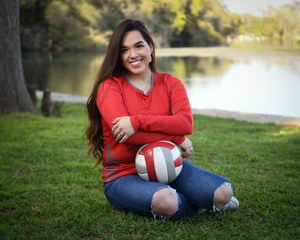 istock High School Senior Megan Posing for Graduation Photos 1135517947