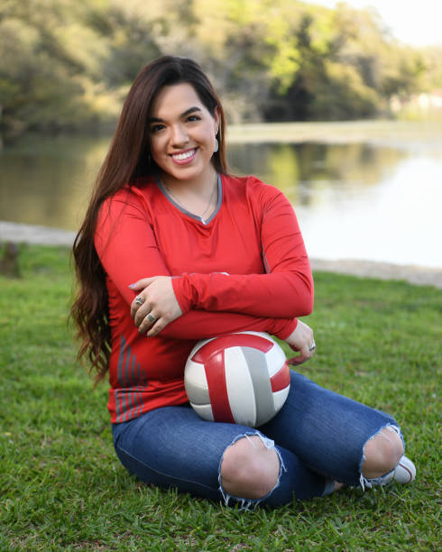 istock High School Senior Megan Posing for Graduation Photos 1135518061