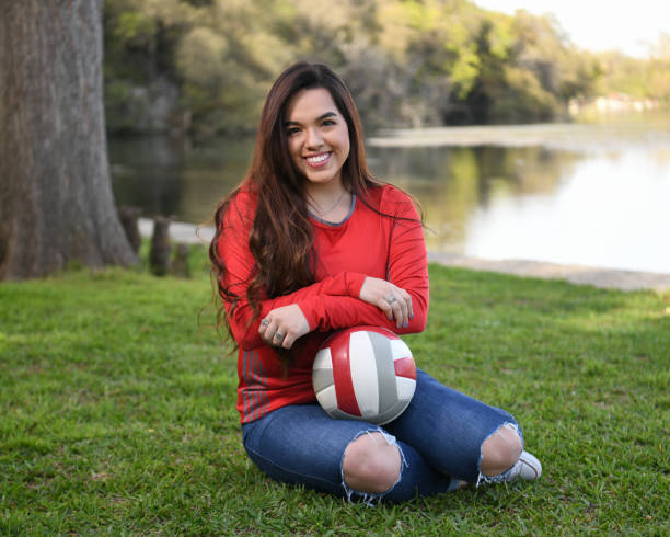 istock High School Senior Megan Posing for Graduation Photos 1135518105