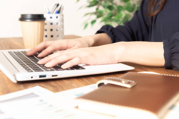 istock Woman hands typing on laptop keyboard at the office 1135518208