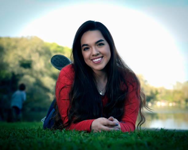 istock High School Senior Megan Posing for Graduation Photos 1135518310